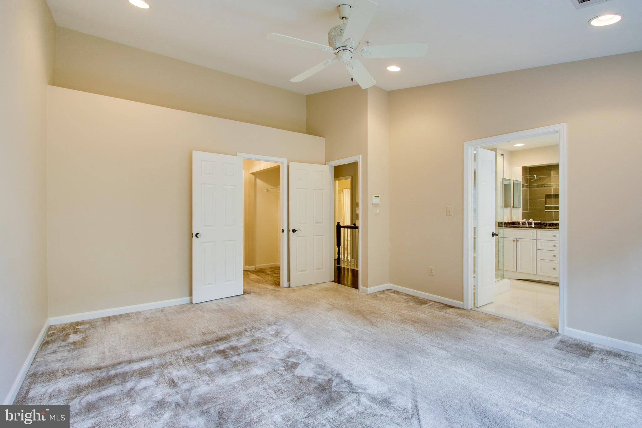8818 Howard Forest Lane Baltimore, MD 21208 - Photo 19 of 31 a view of a big room with wooden floor and windows