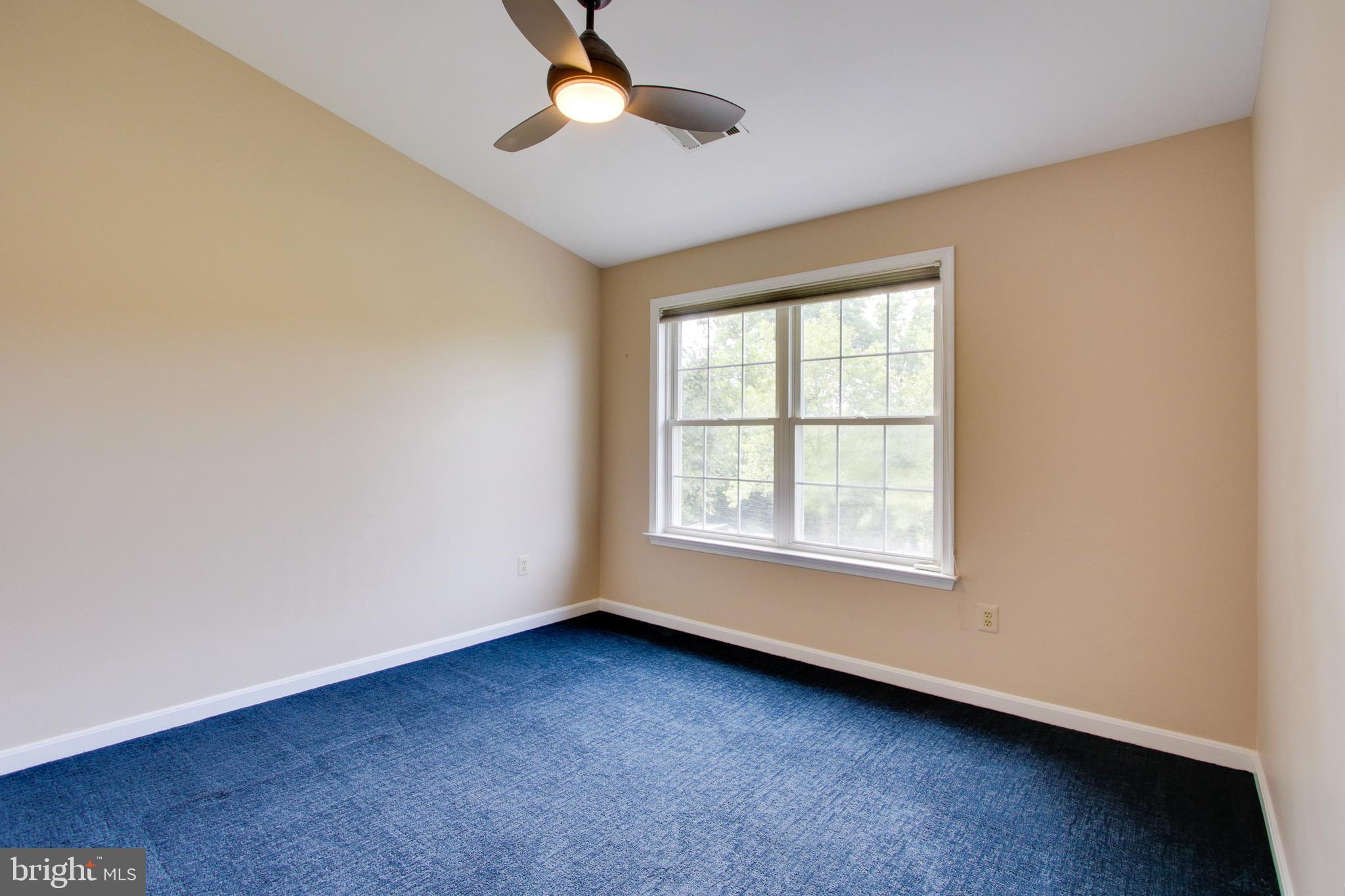 8818 Howard Forest Lane Baltimore, MD 21208 - Photo 25 of 31 an empty room with a window