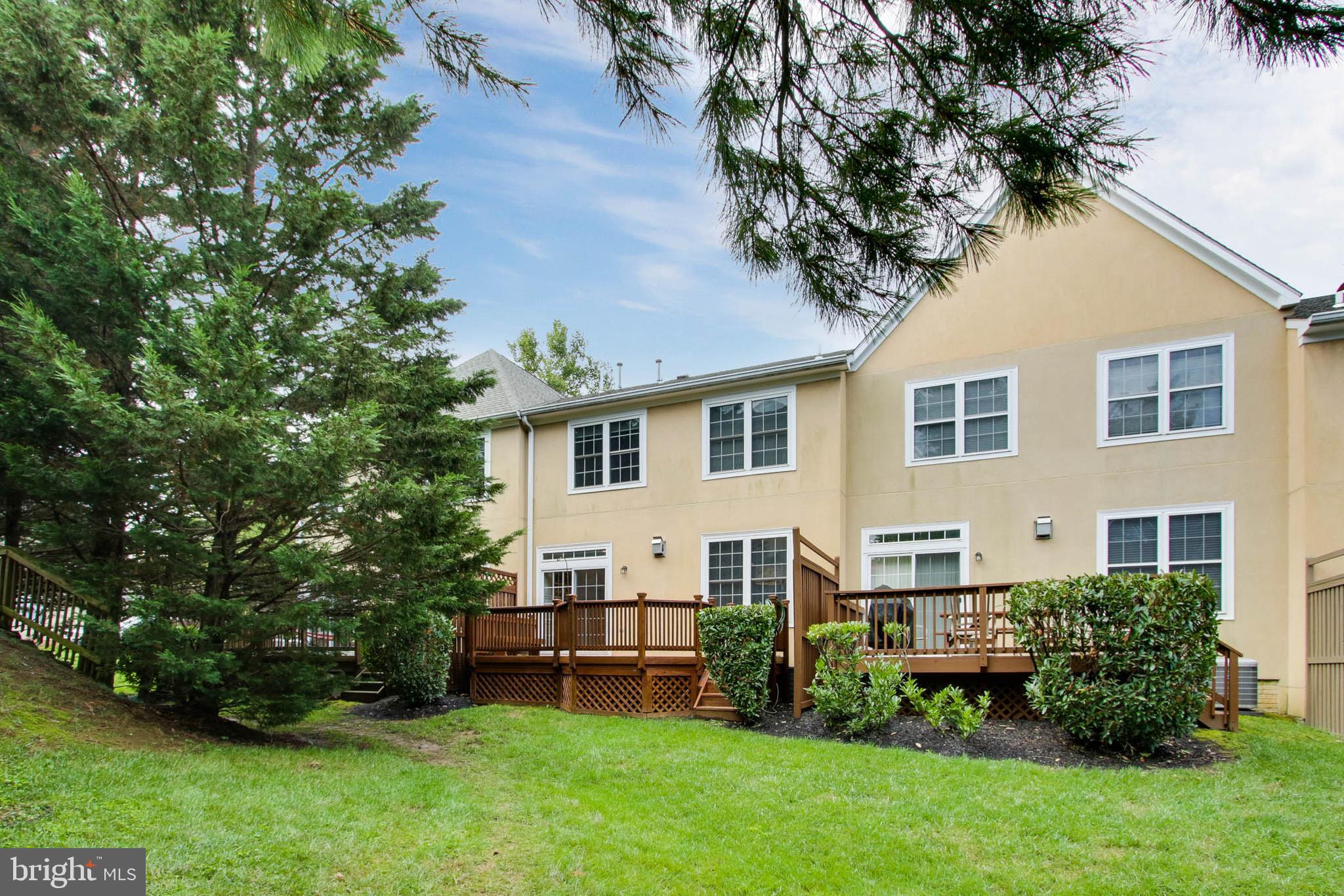 8818 Howard Forest Lane Baltimore, MD 21208 - Photo 29 of 31 a view of a house with a backyard and sitting area