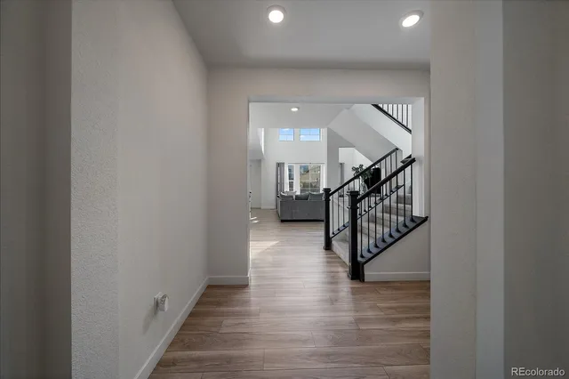 a view of a hallway with stairs