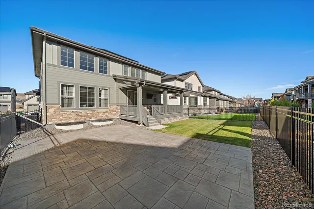a view of house with swimming pool yard and outdoor seating