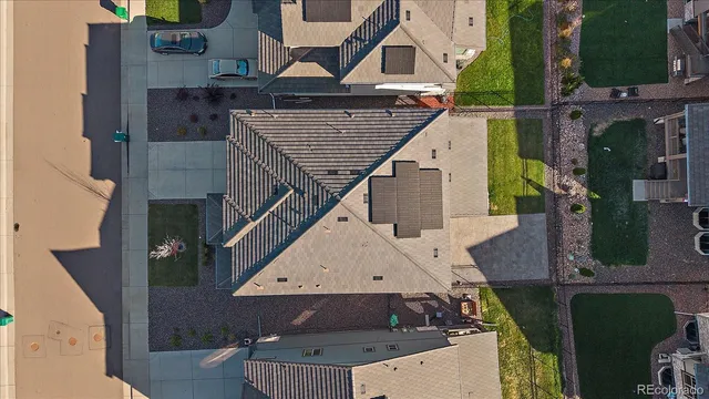 an aerial view of a house with a yard