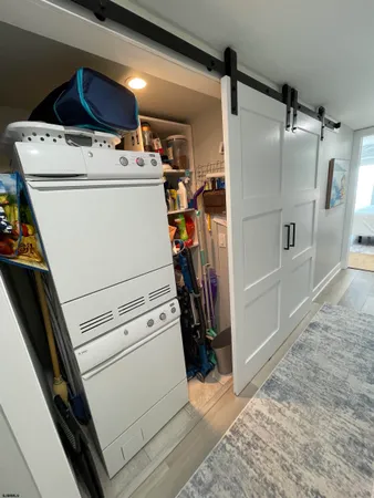 a bedroom with a bed window and a flat screen tv