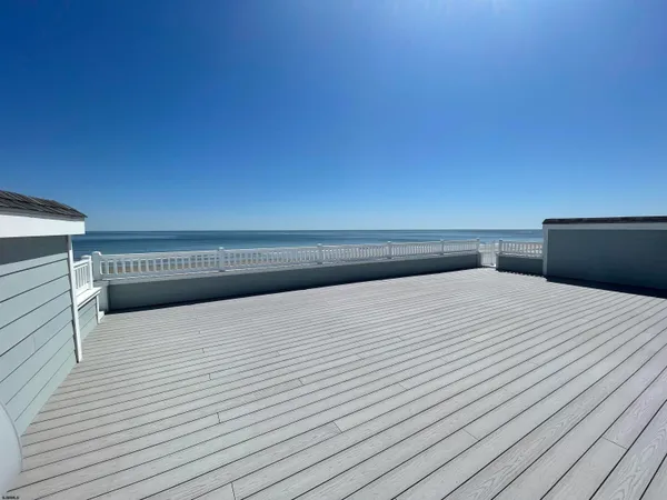 a view of balcony with furniture