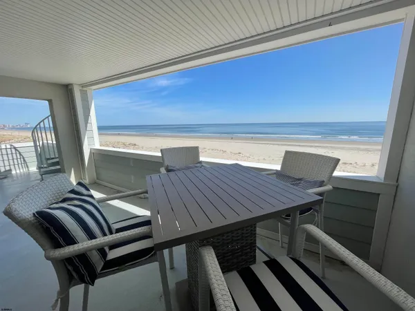 a dinning table sitting next to a window