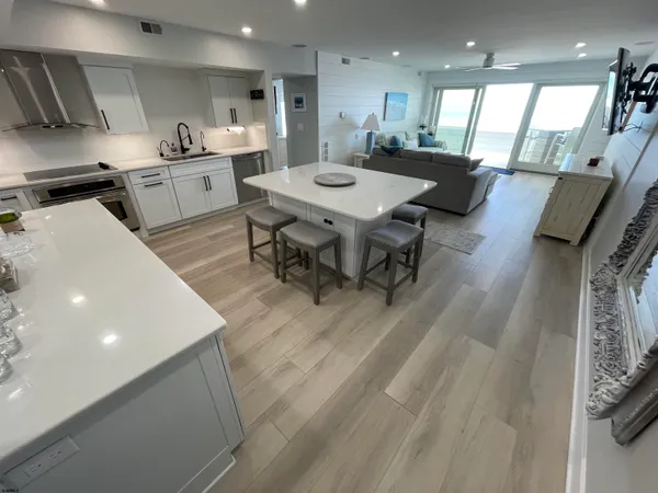 a large kitchen with a table and chairs in it