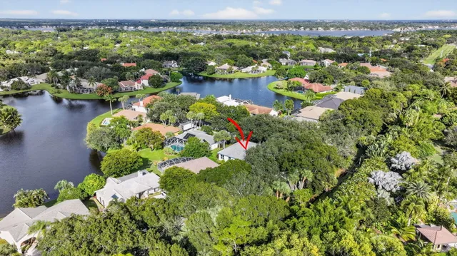a view of a lake with a flower garden