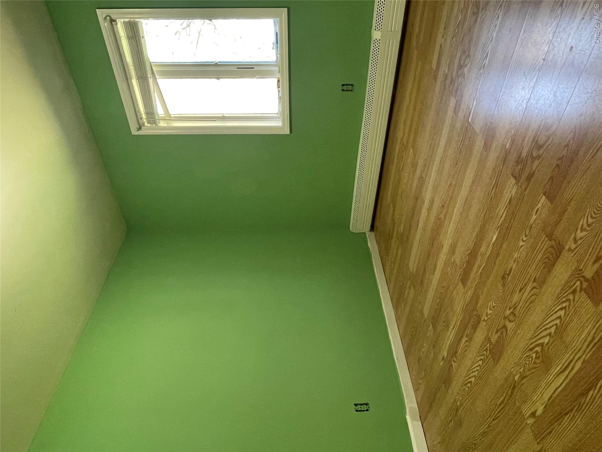 171 Hounslow Road Shirley, NY 11967 - Photo 11 of 31 a view of a room with wooden floor and windows