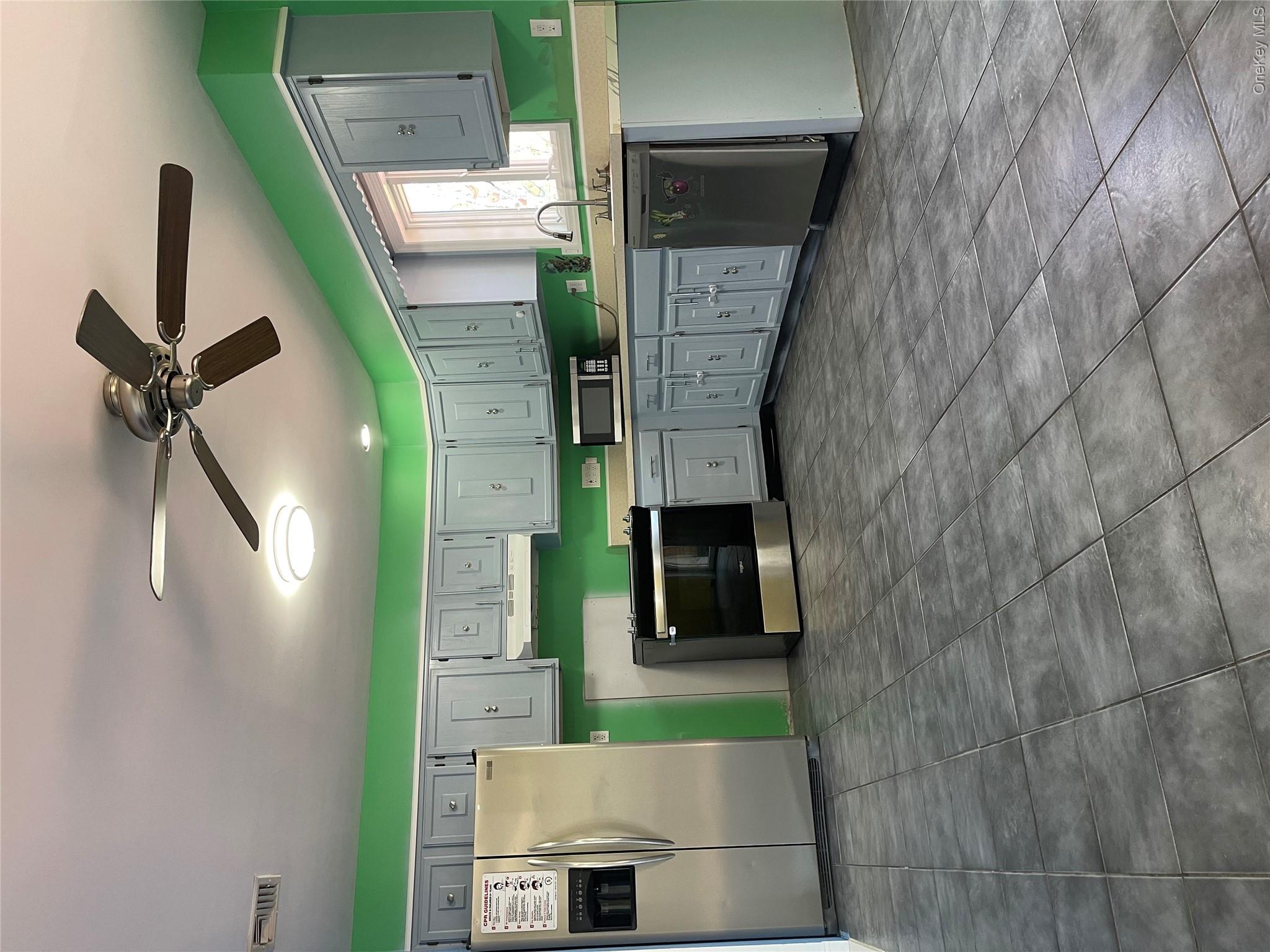 171 Hounslow Road Shirley, NY 11967 - Photo 8 of 31 a large kitchen with cabinets and stainless steel appliances