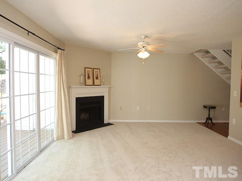 7737 Falcon Rest Circle, Unit 7737 Raleigh, NC 27615 - Photo 2 of 18 With wood burning fireplace