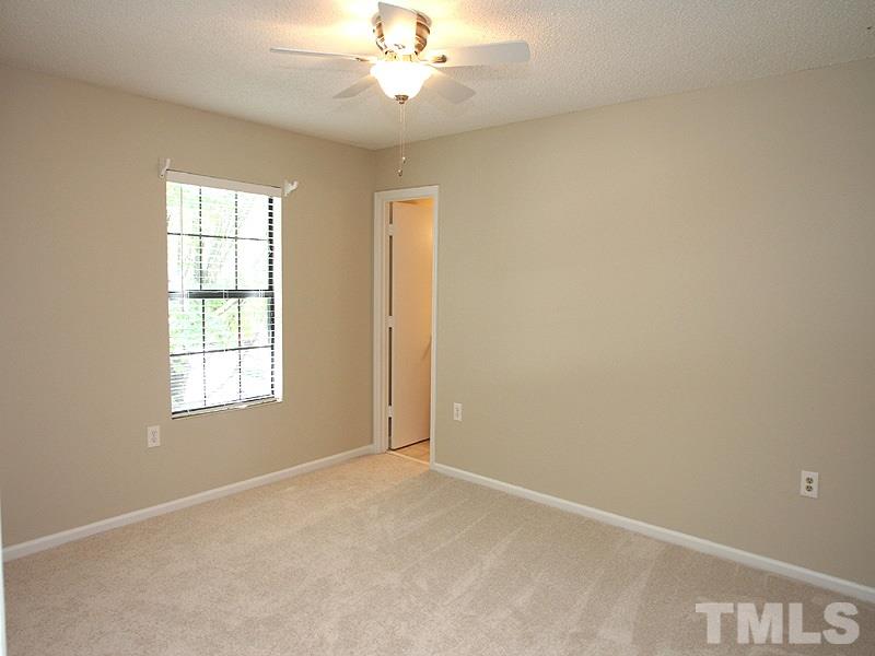 7737 Falcon Rest Circle, Unit 7737 Raleigh, NC 27615 - Photo 9 of 18 With spacious closet, ceiling fan and en suite full bath.