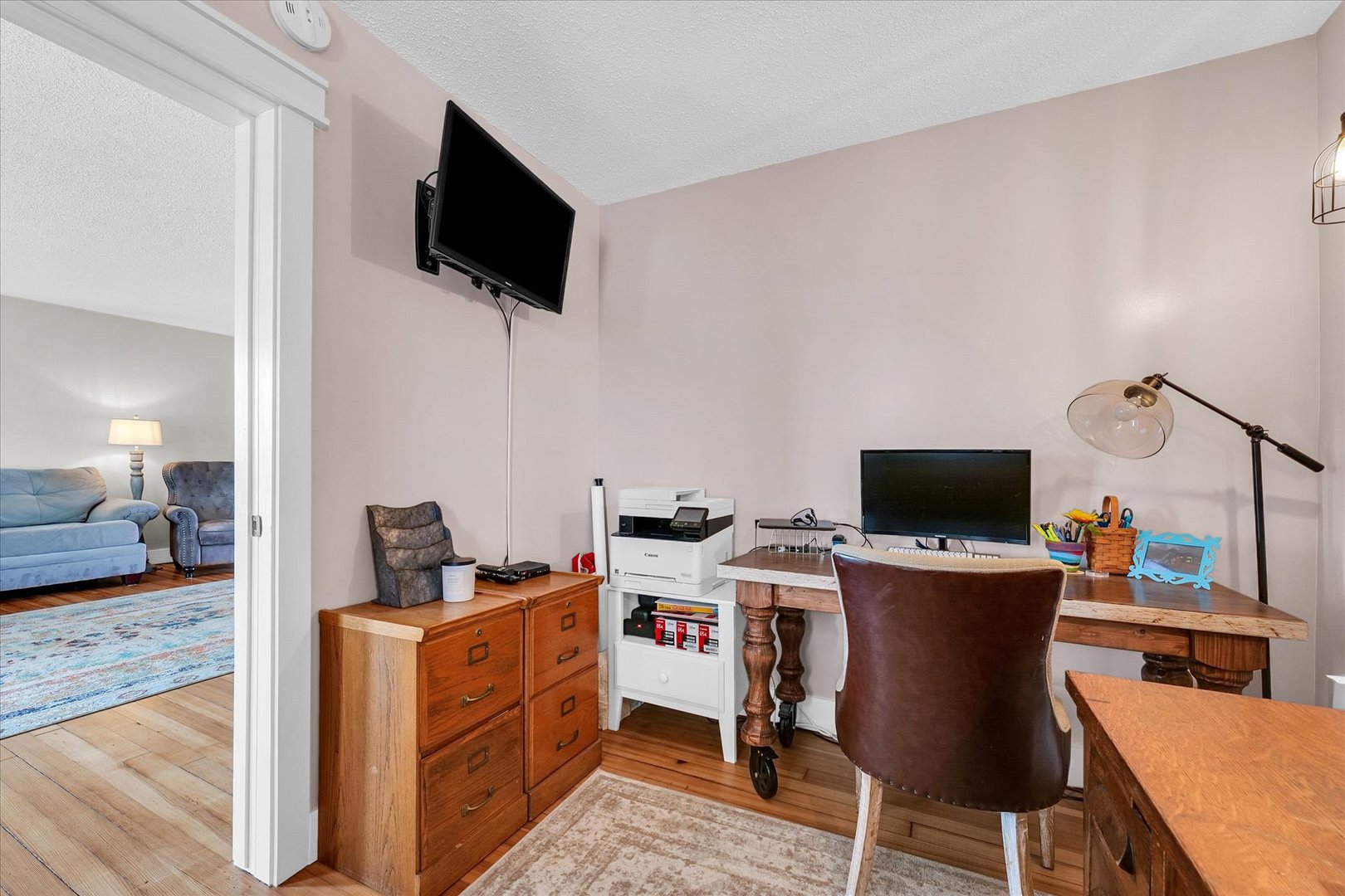 55 North 2600E Road Rankin, IL 60960 - Photo 11 of 48 a view of a workspace with furniture and a flat screen tv
