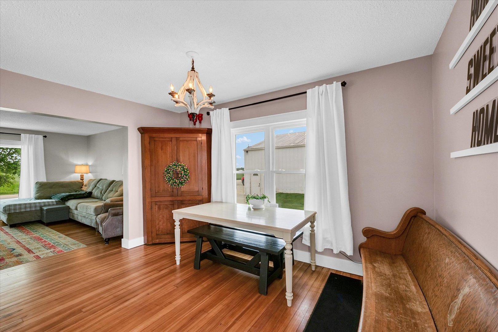 55 North 2600E Road Rankin, IL 60960 - Photo 13 of 48 a living room with furniture two window and a chandelier