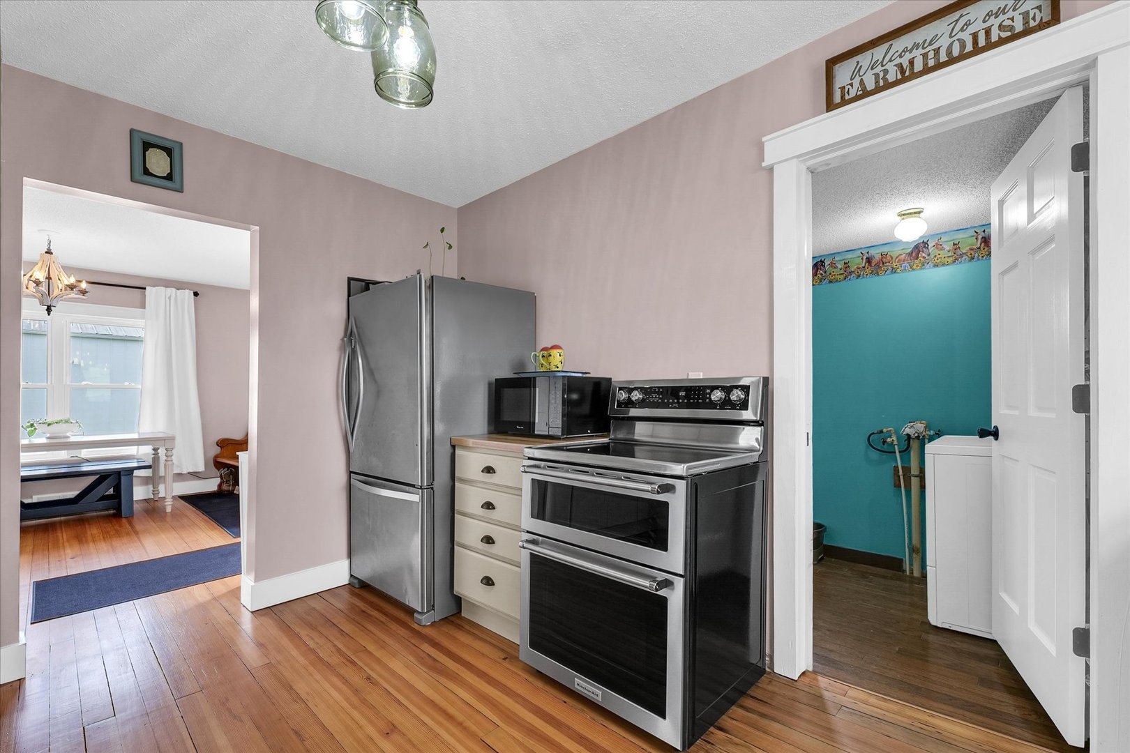 55 North 2600E Road Rankin, IL 60960 - Photo 22 of 48 a kitchen with a refrigerator stove and wooden floor