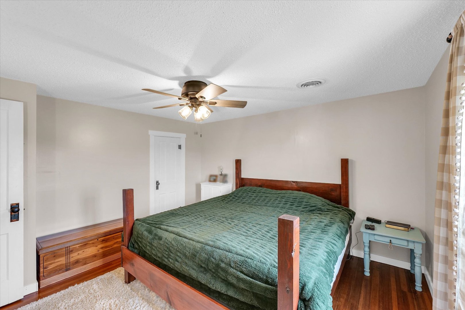 55 North 2600E Road Rankin, IL 60960 - Photo 27 of 48 a bedroom with a bed and a chandelier