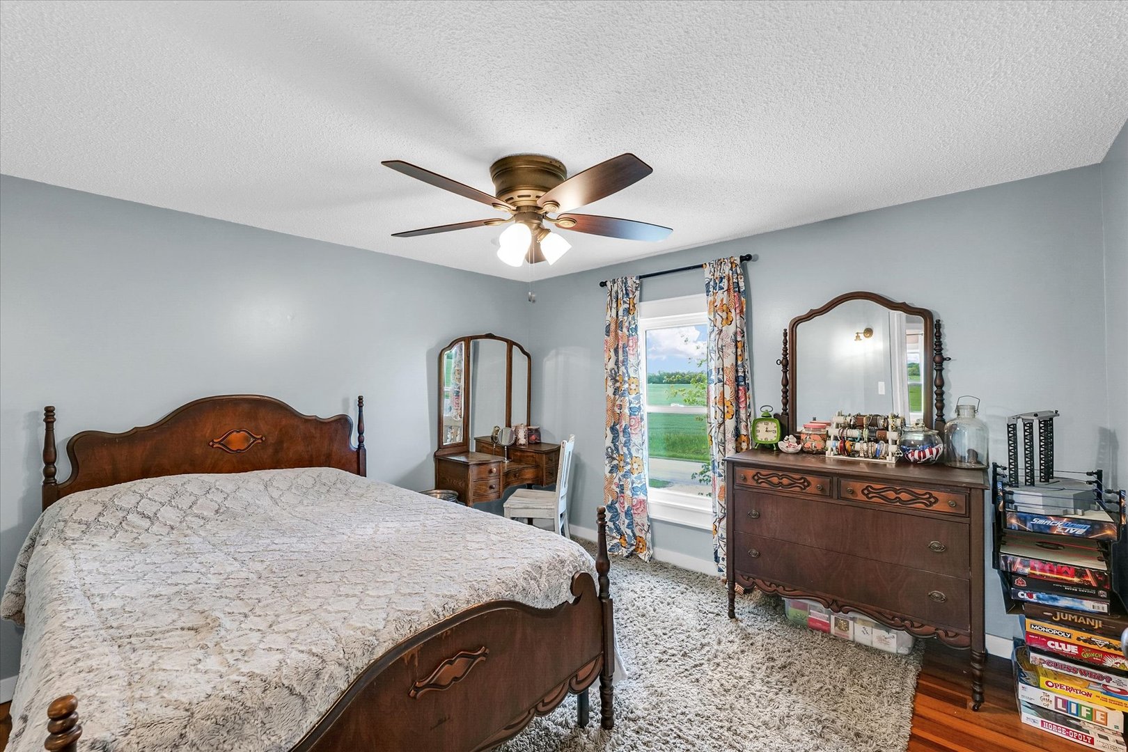 55 North 2600E Road Rankin, IL 60960 - Photo 29 of 48 a bedroom with a bed a large window with table and chairs