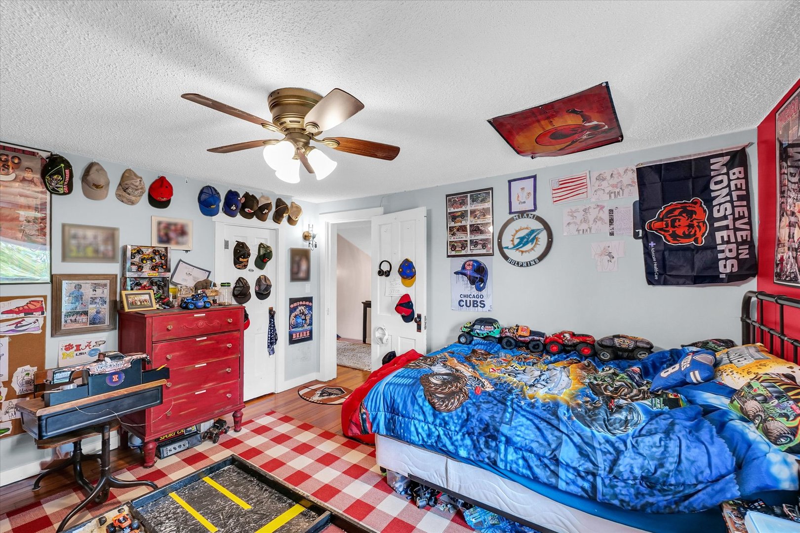 55 North 2600E Road Rankin, IL 60960 - Photo 32 of 48 a bedroom with a bed and a chandelier