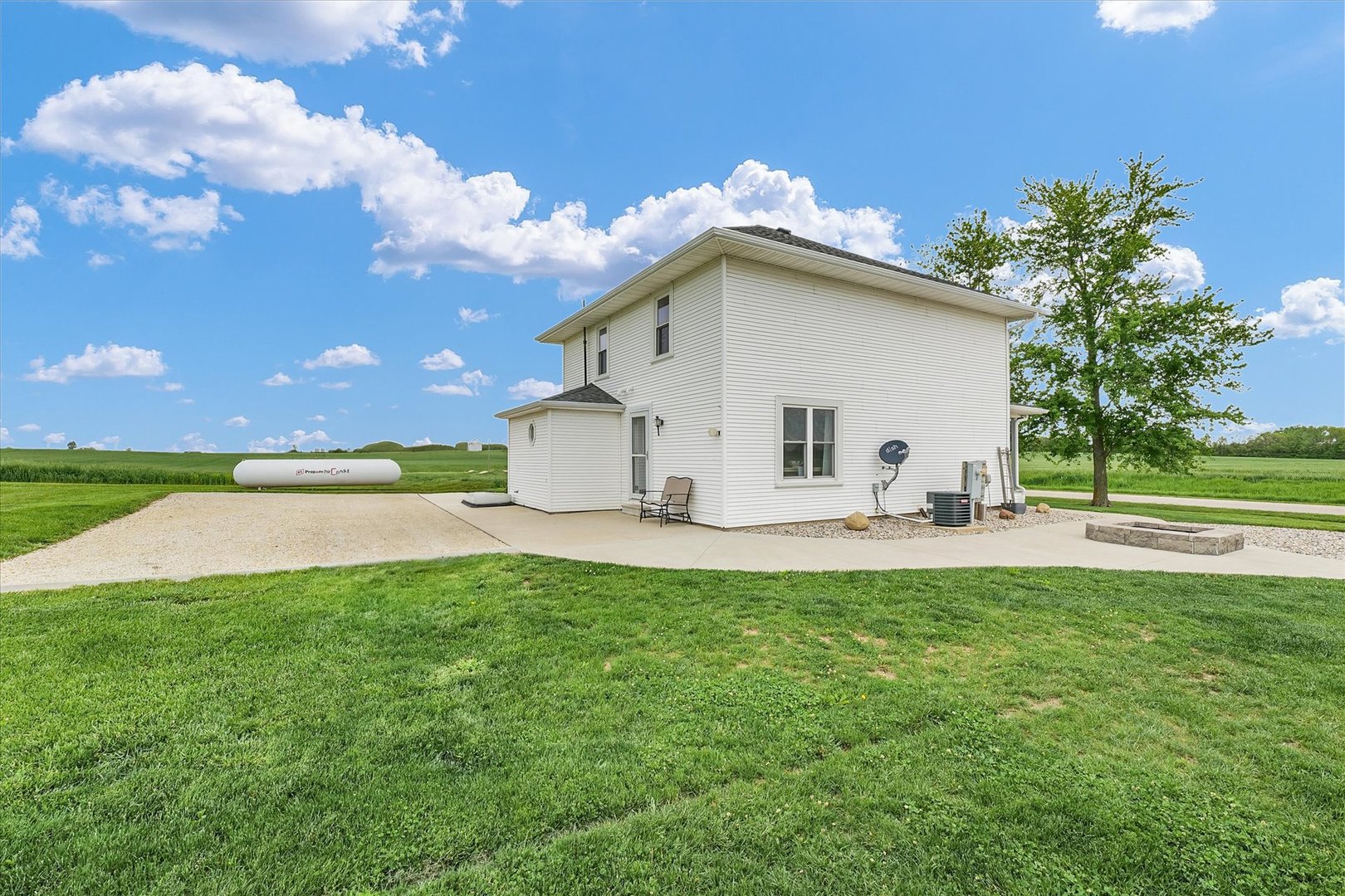 55 North 2600E Road Rankin, IL 60960 - Photo 41 of 48 a view of a house with backyard and sitting area