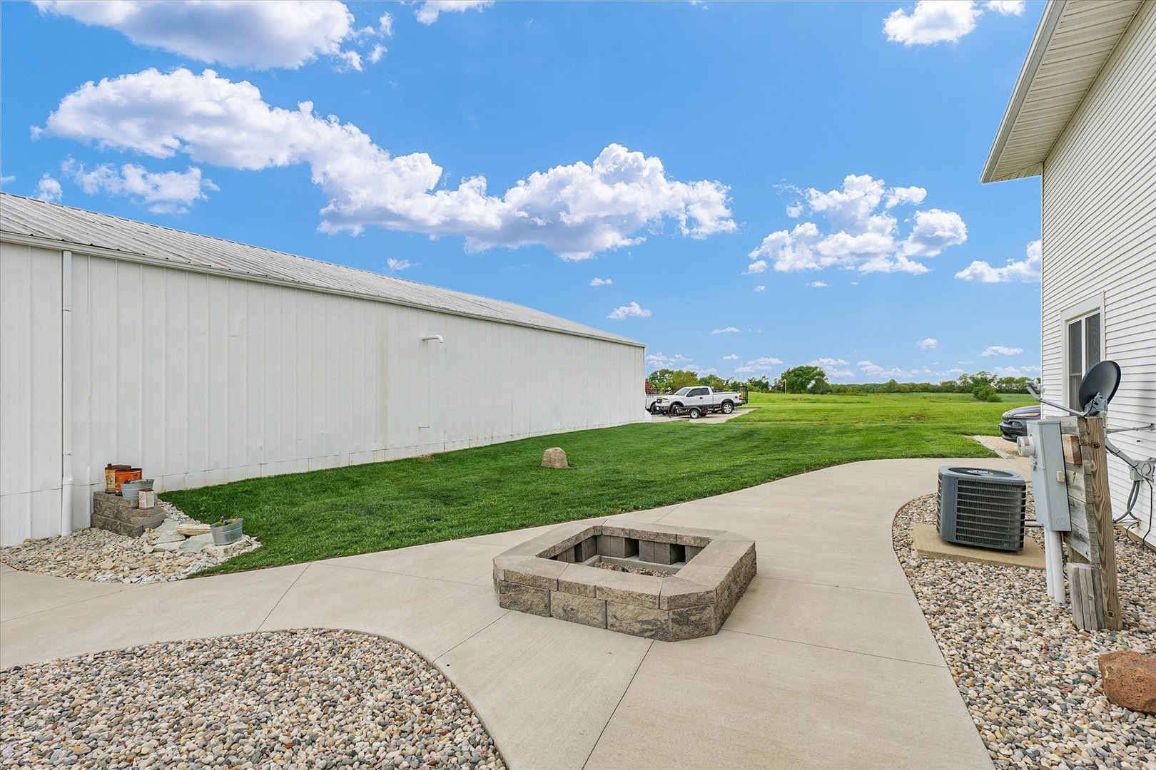 55 North 2600E Road Rankin, IL 60960 - Photo 44 of 48 a backyard of a house with lots of green space and outdoor seating