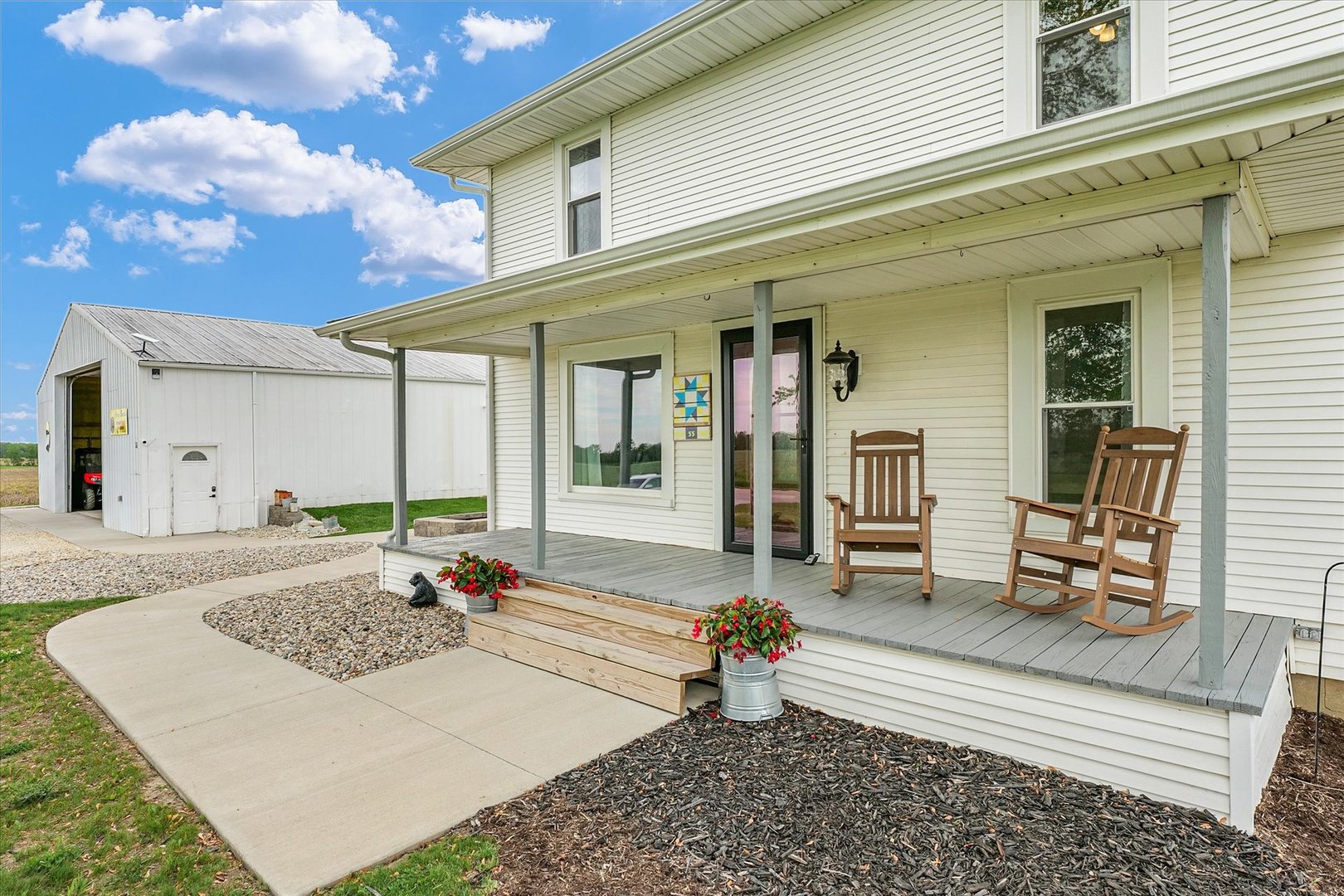55 North 2600E Road Rankin, IL 60960 - Photo 6 of 48 a front view of a house with a outdoor seating