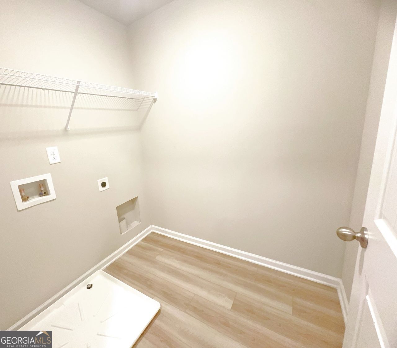 446 Sawmill Trace Hampton, GA 30228 - Photo 13 of 15 a view of a room with racks on the wall