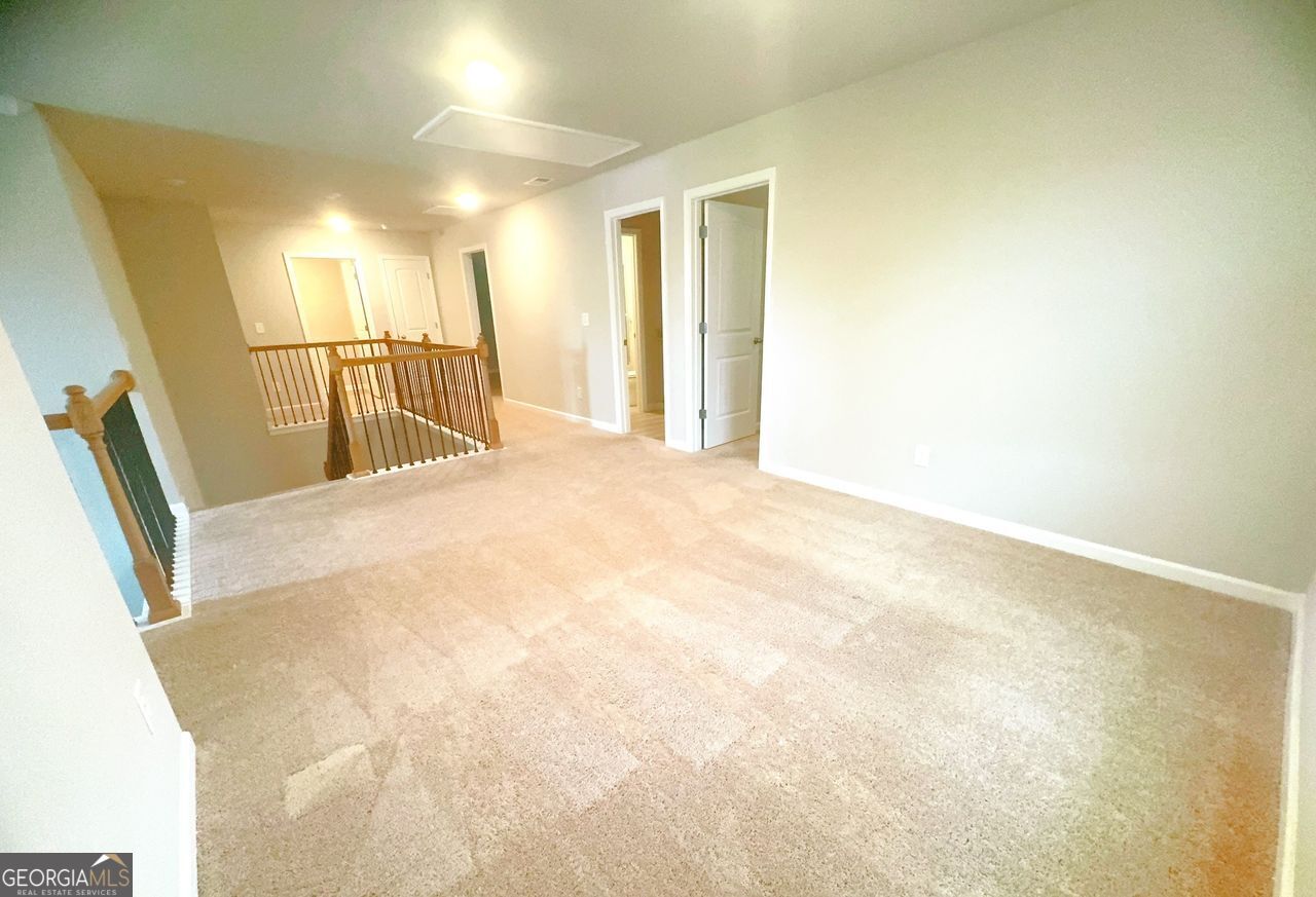 446 Sawmill Trace Hampton, GA 30228 - Photo 10 of 15 a view of a hallway with wooden floor