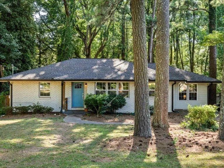 Undisclosed Address Decatur, GA 30032 - Photo 1 of 7 front view of a house with a yard