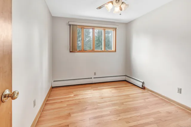 a view of an empty room with a window