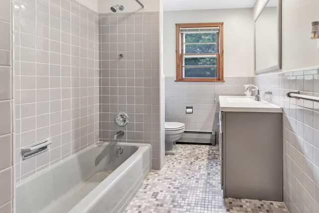 a bathroom with a bathtub sink and toilet