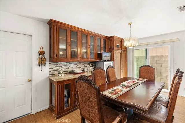 a view of a dining room with furniture and window