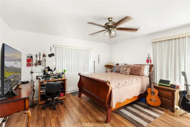 a bed room with a bed and a window