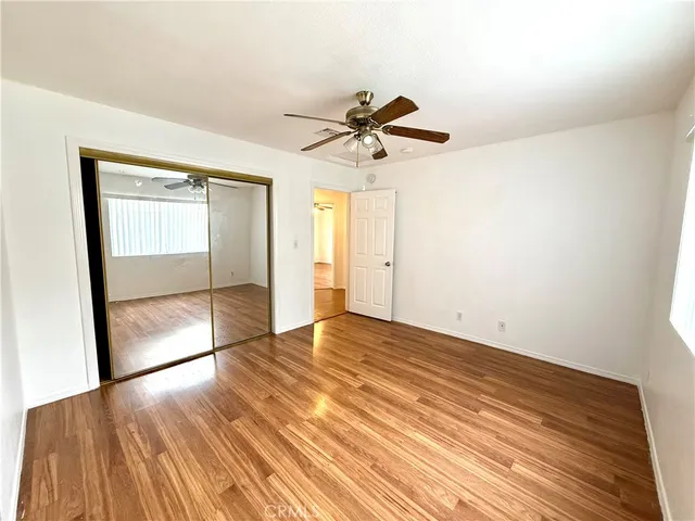 a view of residential houses with outdoor space and parking