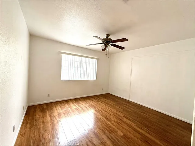 an aerial view of multiple houses with yard