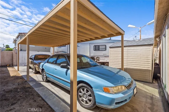 a front view of a house with parking space