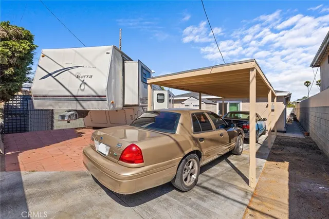 a house view with a sitting space and garden space