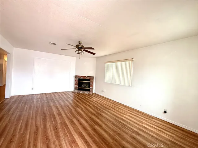 a kitchen with stainless steel appliances granite countertop a sink a stove and refrigerator