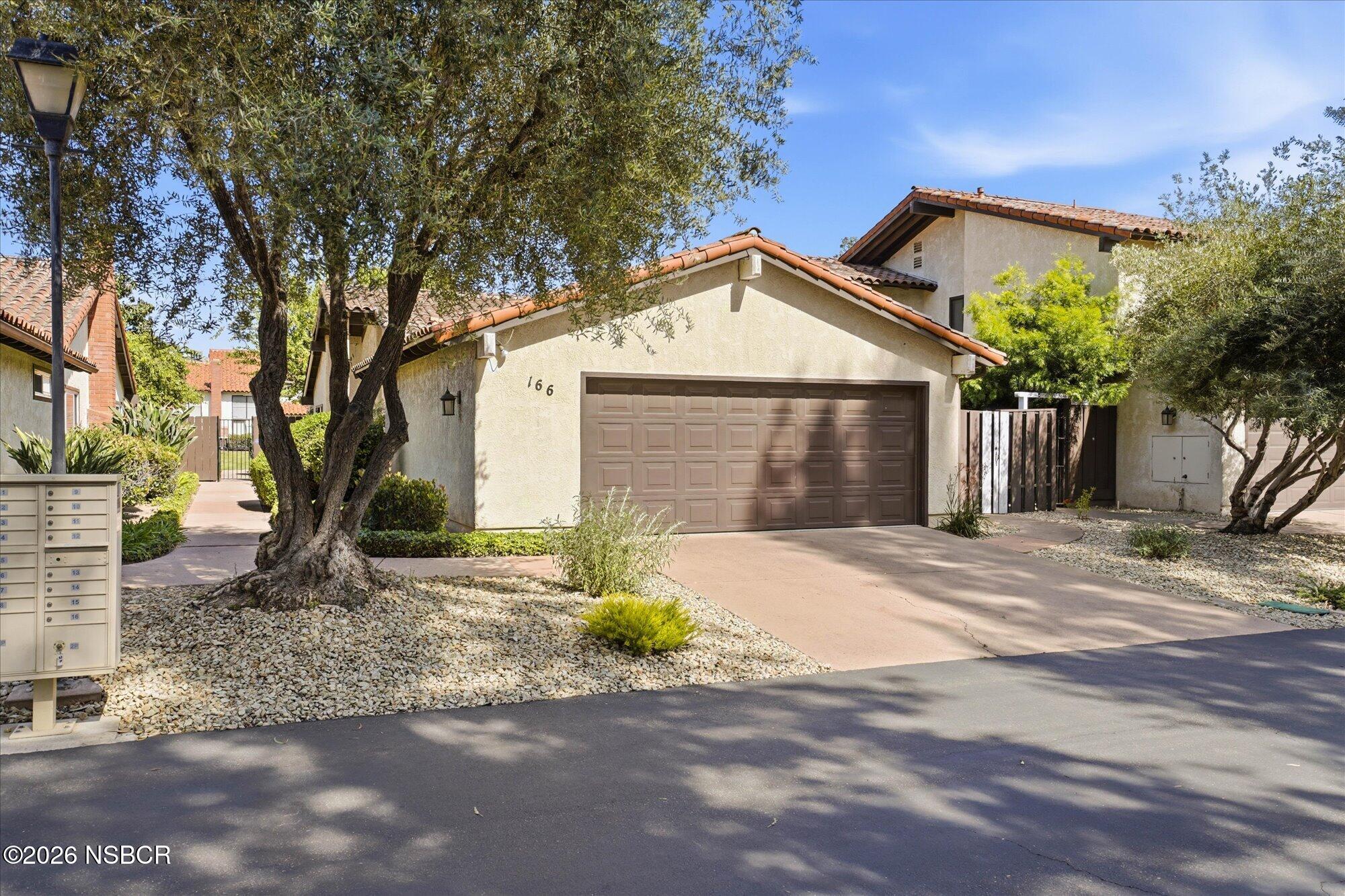166 Tallyho Road Santa Maria, CA 93455 - Photo 2 of 20 a front view of a house with a yard and garage