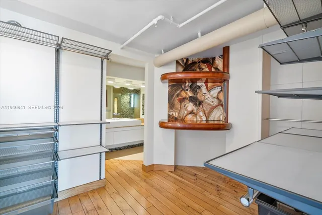 a bathroom with a toilet and a shower curtain