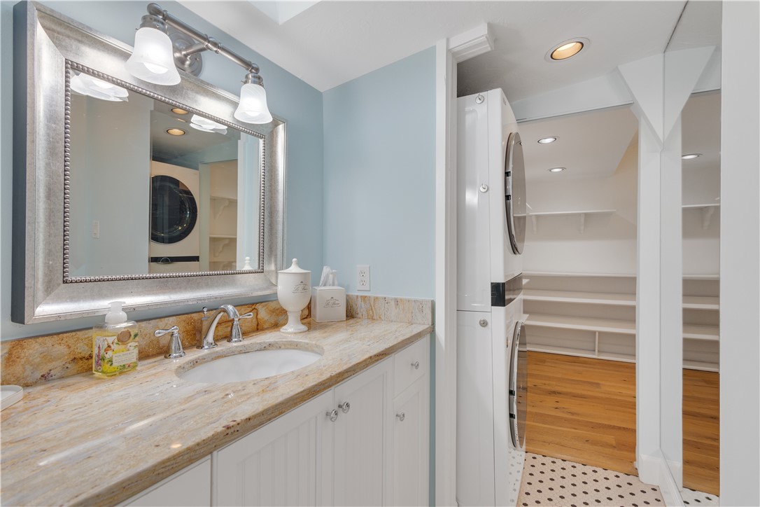 1971 Pebble Path Vero Beach, FL 32963 - Photo 19 of 36 a bathroom with a granite countertop sink and a mirror
