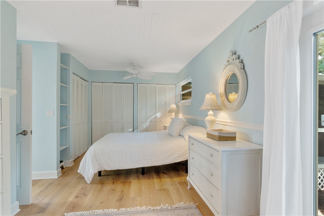 1971 Pebble Path Vero Beach, FL 32963 - Photo 21 of 36 a bedroom with a bed and a chandelier