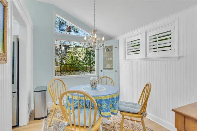 a view of a dining room with furniture window and outside view