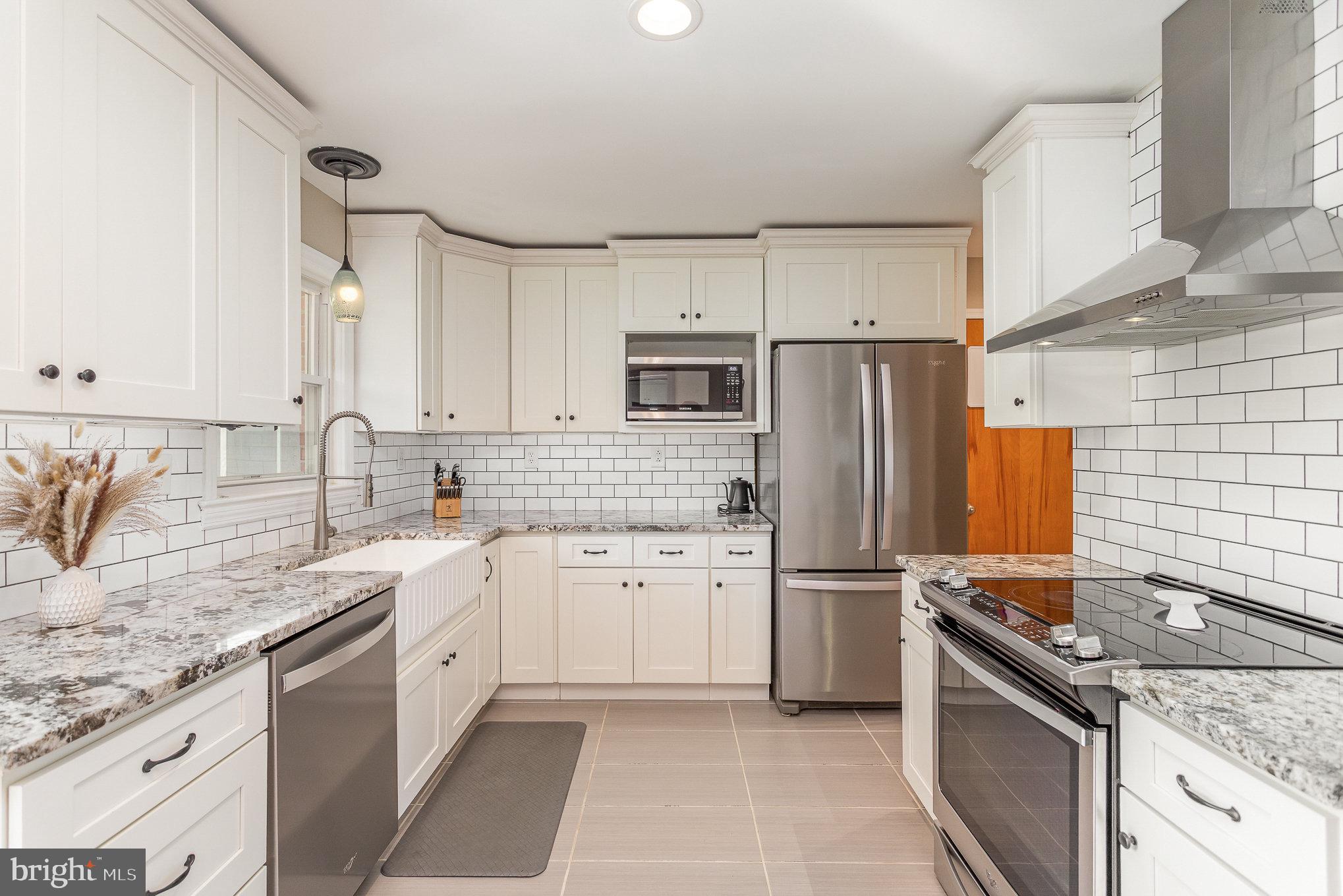 1556 Lambeth Road Lancaster, PA 17601 - Photo 11 of 42 a kitchen with a sink stove and refrigerator