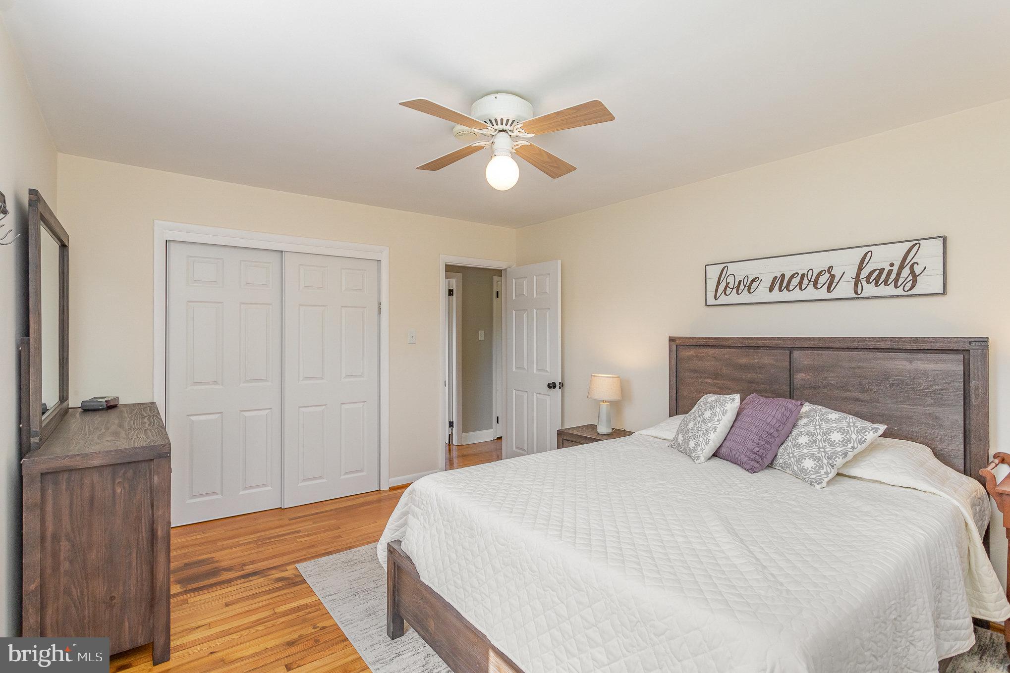 1556 Lambeth Road Lancaster, PA 17601 - Photo 14 of 42 a bedroom with a bed and a chandelier