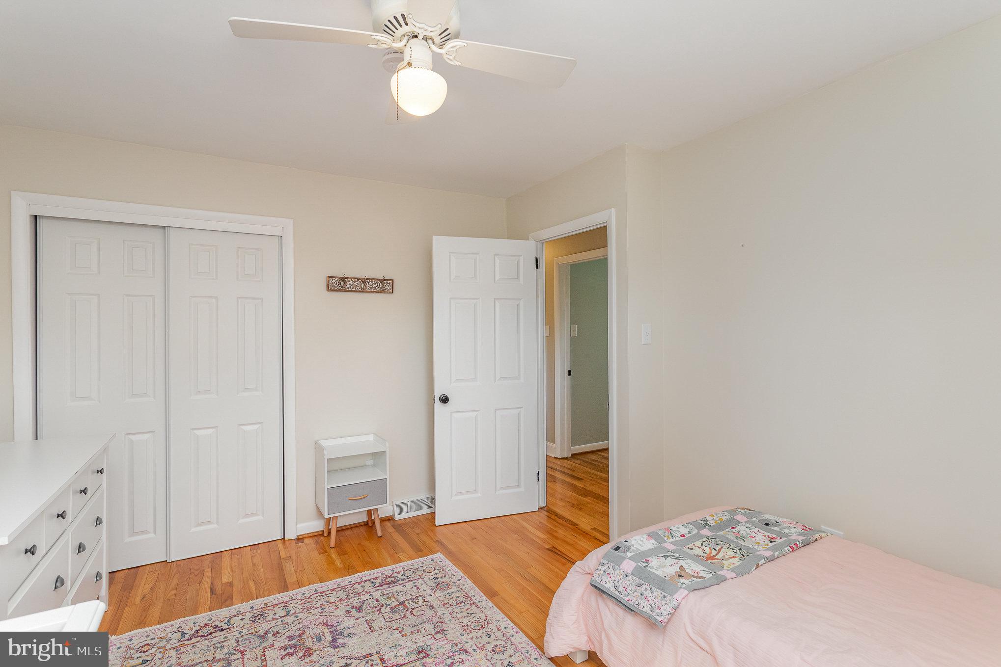 1556 Lambeth Road Lancaster, PA 17601 - Photo 18 of 42 a bedroom with a bed and wooden floor