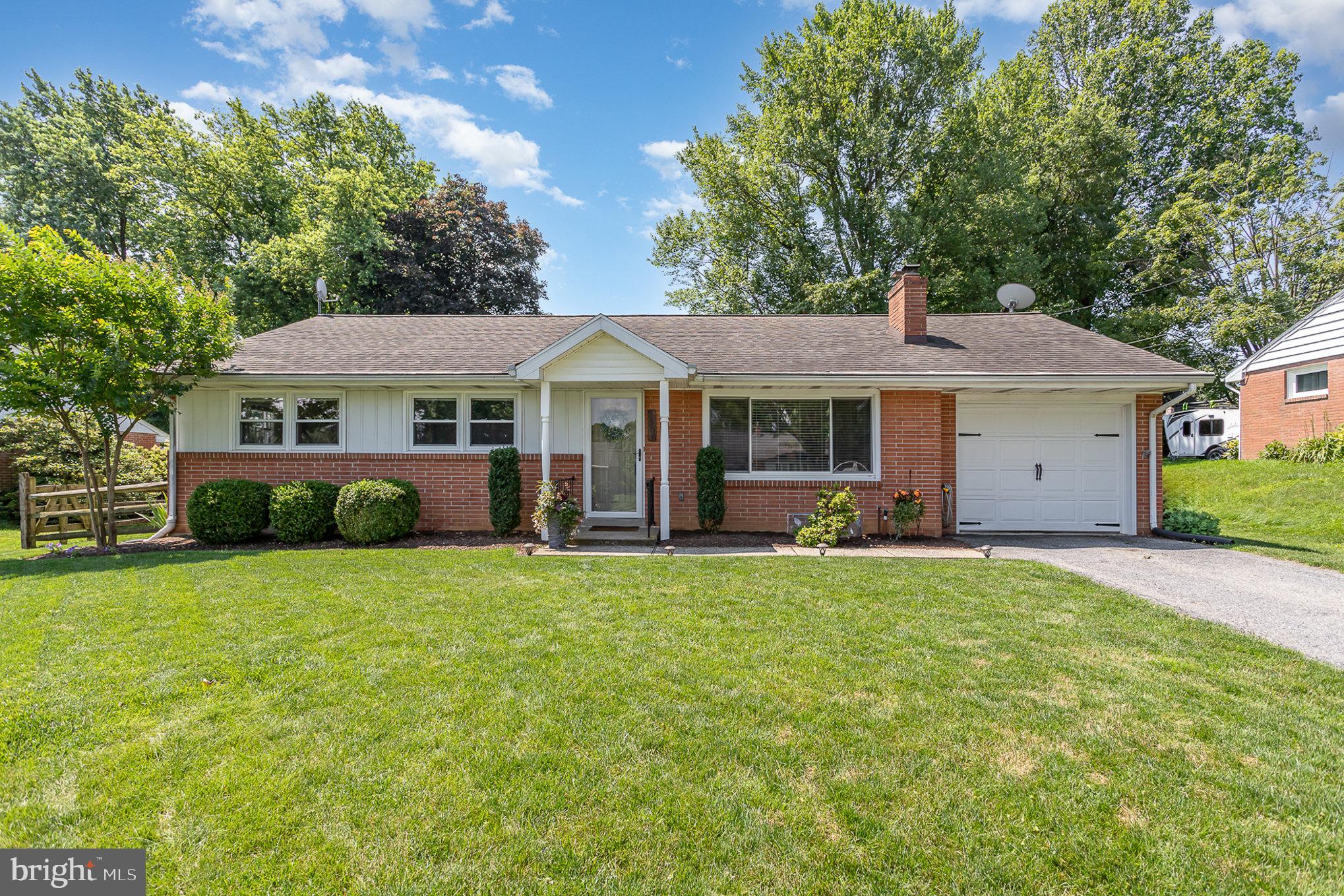 1556 Lambeth Road Lancaster, PA 17601 - Photo 2 of 42 a view of a house with a yard and sitting area