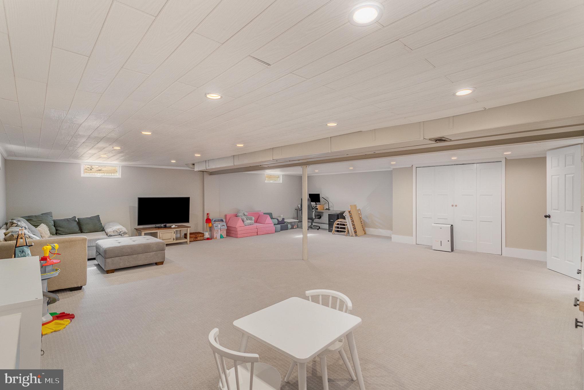 1556 Lambeth Road Lancaster, PA 17601 - Photo 22 of 42 a living room with furniture and a flat screen tv