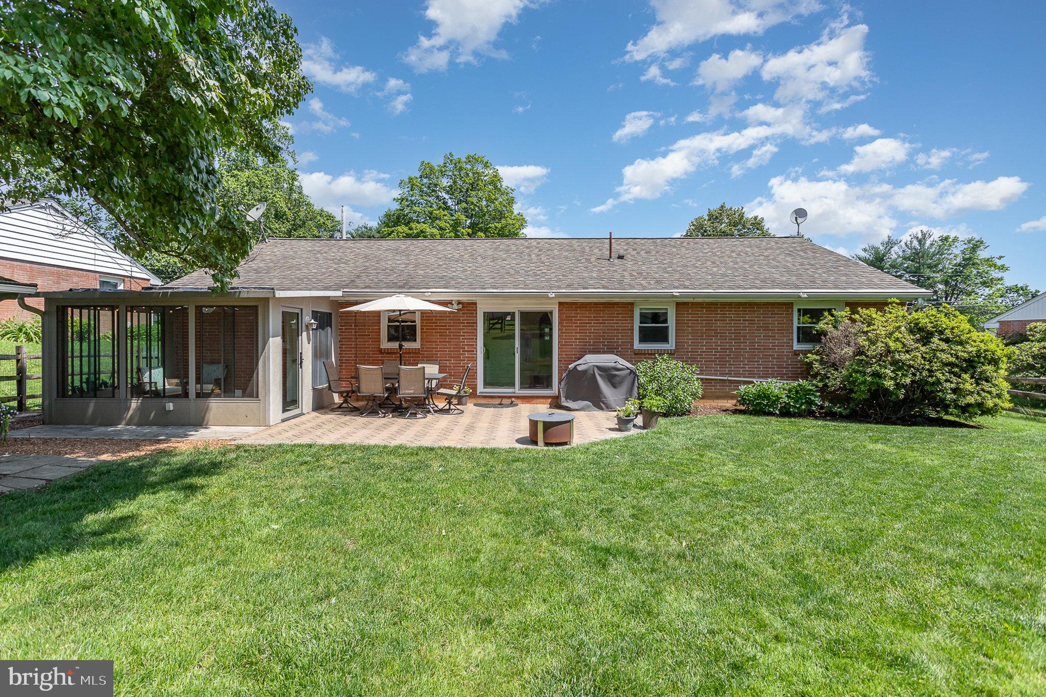 1556 Lambeth Road Lancaster, PA 17601 - Photo 27 of 42 a view of a house with a patio and a yard