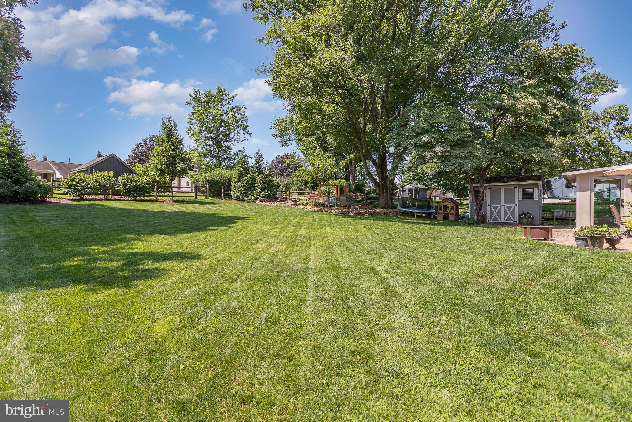 1556 Lambeth Road Lancaster, PA 17601 - Photo 30 of 42 a view of a house with a big yard and palm trees