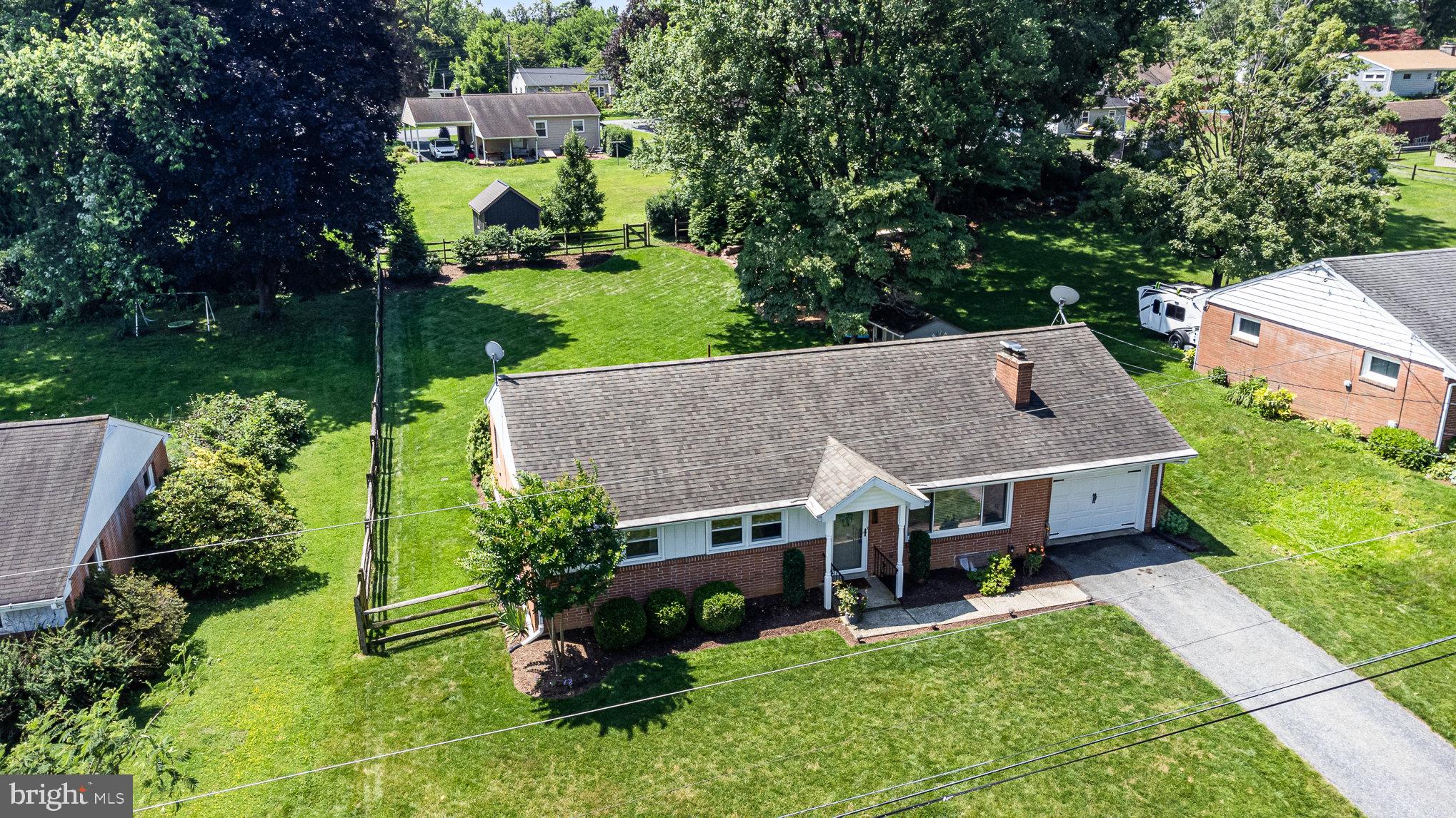 1556 Lambeth Road Lancaster, PA 17601 - Photo 33 of 42 an aerial view of a house with a yard table and chairs
