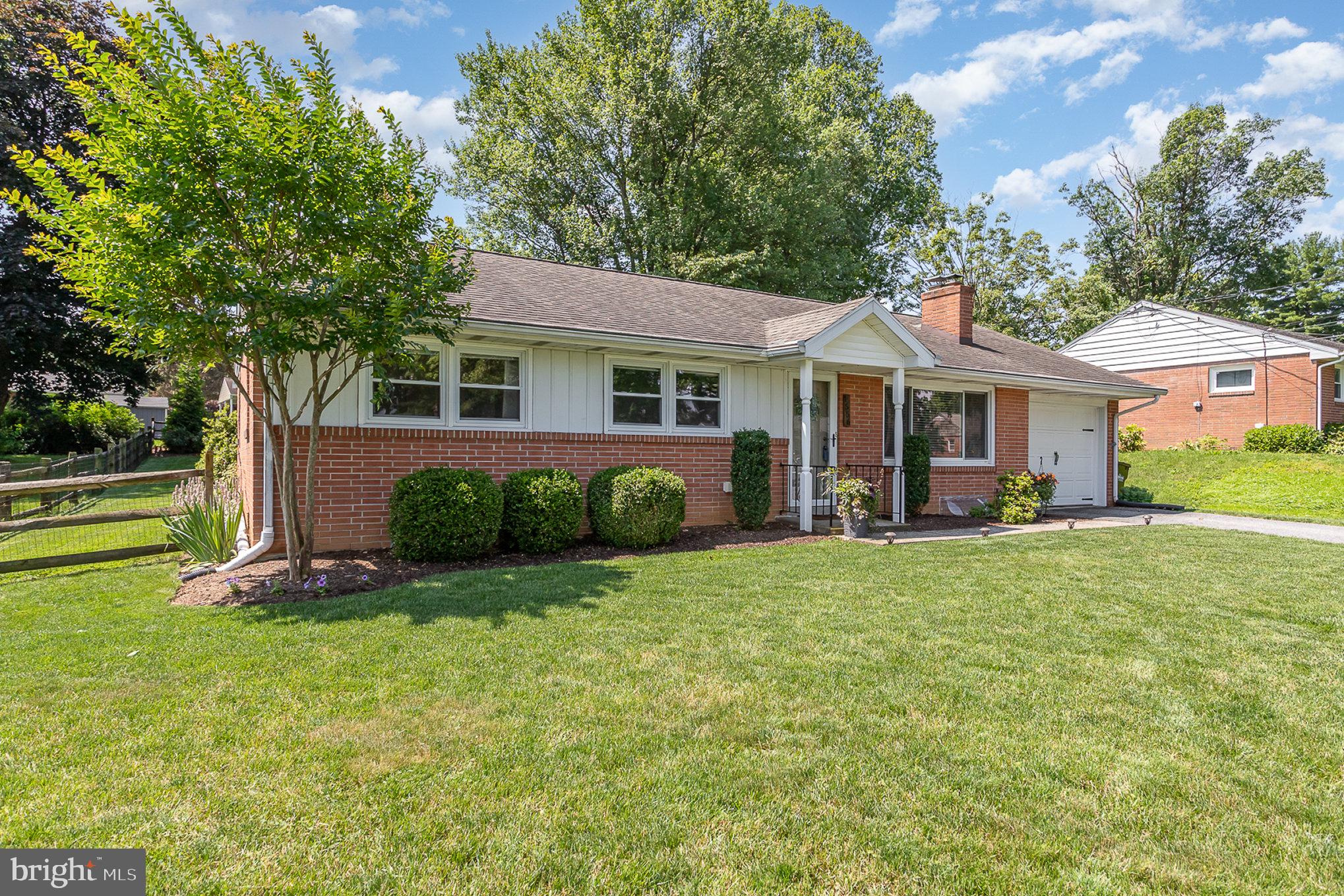 1556 Lambeth Road Lancaster, PA 17601 - Photo 4 of 42 a view of a house with a yard and plants